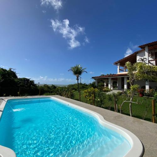 Casa Mar a Vista - Suítes em Cumuruxatiba, BA - pousada e hospedagem