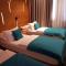 Hotel Sana - Deluxe Dreibettzimmer