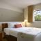 Affordable Suites of America Grand Rapids - Deluxe Queen Studio Suite - Niet Roken
