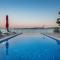 Gem of the sea luxury beach apartment with brand new heating infinity pool