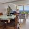 Holiday Inn Resort Panama City Beach, an IHG Hotel - Luxury King Suite, 2 Rooms, Living Room, Dining Room, 2 Balconies