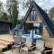 Widgeon Bespoke Cabin is lakeside with Private fishing peg, hot tub situated at Tattershall Lakes Country Park