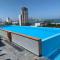 Torre con roof top y piscina con vista al mar