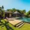 Villa sur le golf avec piscine et jardin tropical