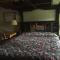 Highland Hills Motel & Cabins - King Room Log Motel