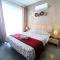 Central Apartment with Balcony by Apricus Design