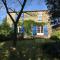 Maison aux volets bleus
