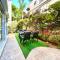 Beautiful garden apartment next to the beach