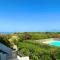 Appartement entre la lagune et la mer avec piscine, direct plage, vue partielle mer