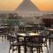 AKHNATON Pyramids View Hotel With Rooftop Access & free airport pickup
