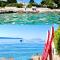Luxury Seaside Villa with a classic Mediterranean Olive Garden, a fully equipped Professional Kitchen, Pool, Sauna, Padle Boards and Canoe - Miolin Beach House
