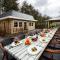 Designed home with bedstead, surrounded by forest