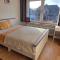Ein bequemes Zimmer in einer ruhigen Umgebung Näher Zentrum mit gemeinsam genutzte Bad und Küchengeräte