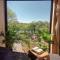 Domy w ogrodzie - Riverfront cabins