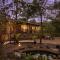 SaffronStays Terra Soul - 3BR eco-luxury pet-friendly pool villa with gazebos, bar & fish pond near Imagica & Pali Temple