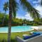 Beachside 1 Bedroom Apartment with Ocean View, Garden and 2 Swimming Pools