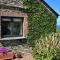 Polrunny Farm Seaberry Cottage with a sea view and log burner