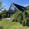 Lovely Beach Home Enveloped In Green Surroundings