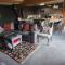 Chalet close to Heathrow T5, Windsor Castle, Legoland, Thorpe Park, with off road parking, free Wifi, private garden, spacious & fully equipped, cozy wood burner & comfy sofa, ideal for exploring London with trains to Waterloo, a beautiful unique retreat
