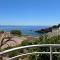 Studio calme vue mer pieds dans l'eau