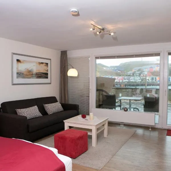 Appartements am Binnenhafen، فندق في هيلغولاند