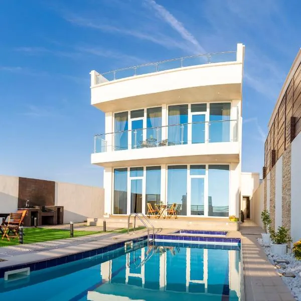 Sunrise Villas, hotel in Al Ashkharah