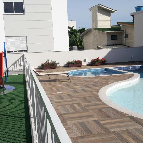 Florianópolis Canasvieiras Apartamento inteiro 3 quartos com ar piscina playground 2 garagens - Foto 4