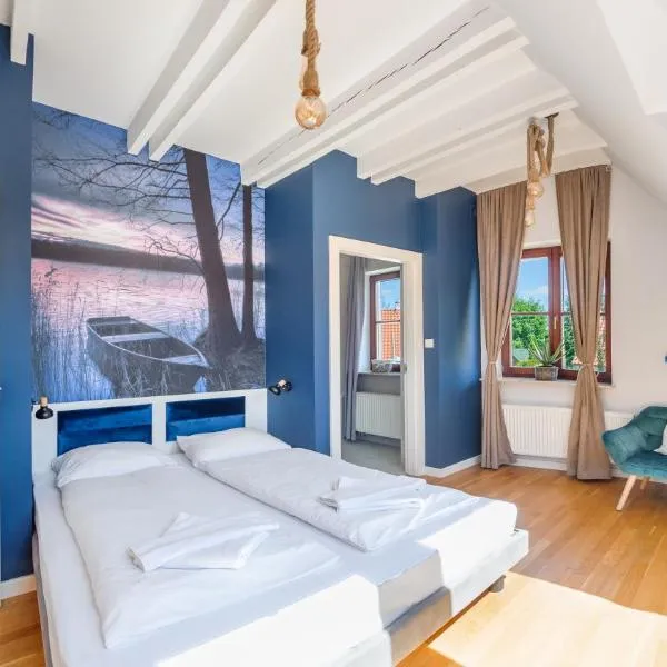 Domy nad Jeziorem Sun & Snow Osada Zamkowa – hotel w Pasymiu