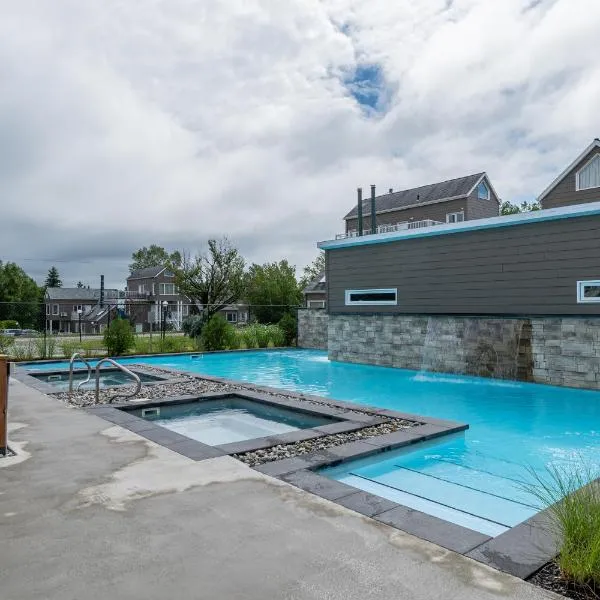 Condo climatisé près du Mont Sainte-Anne avec parc aquatique, piscine, spa, gym, arcades et billard ! โรงแรมในโบเพร