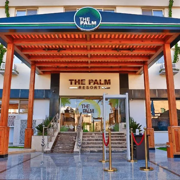 The Palm Hotel, hôtel à Maḩallat al Burj