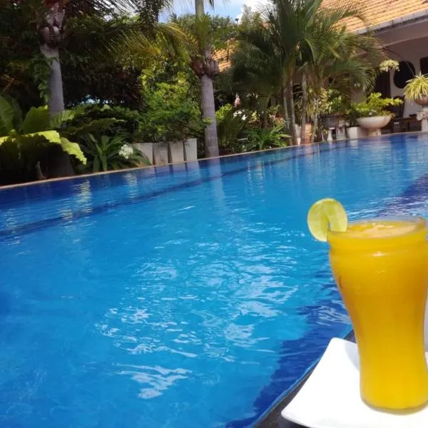 Embiente Guest House, hotel v Negombu