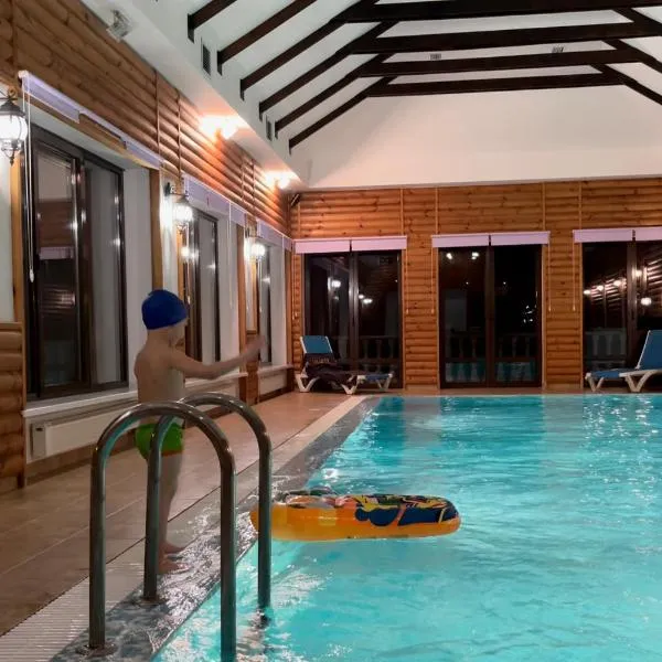 Приватний будинок для сімейного відпочинку з басейном і сауною, hotel v destinaci Grigorʼyevka