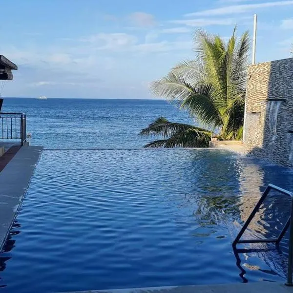 Beachfront Vacation Villa with Infinity Pool、De la Pazのホテル