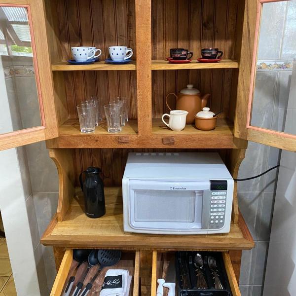 Casa aconchegante à 400m da Praia da Tartaruga - Ar condicionado - WIFI 450MB - Netflix - Cozinha Completa - Garagem - Foto 4