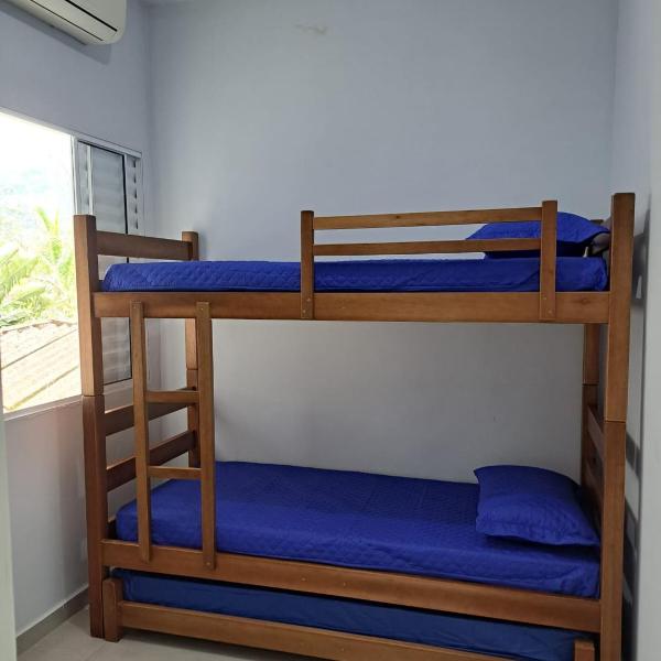 Casa nova com 3 quartos, equipada com Ar Condicionado, TV, Internet e Área de Lazer Completa - Boiçucanga - Foto 2