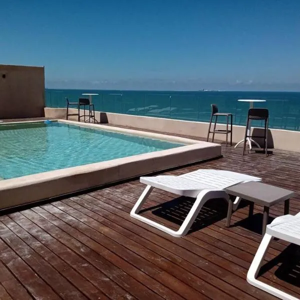 OLEA Beach Condos en Chicxulub Puerto, hotel in Chicxulub