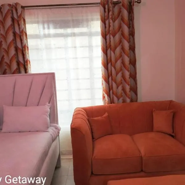Comfy Getaway STUDIO apartment near JKIA & SGR with KING BED, WIFI, NETFLIX and SECURE PARKING, hôtel à Syokimau