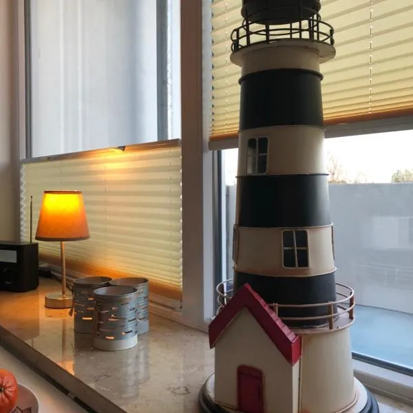 Ferienwohnung Sandküste mit Strandkorb & Indoor Spielplatz, hotel in Heiligenhafen