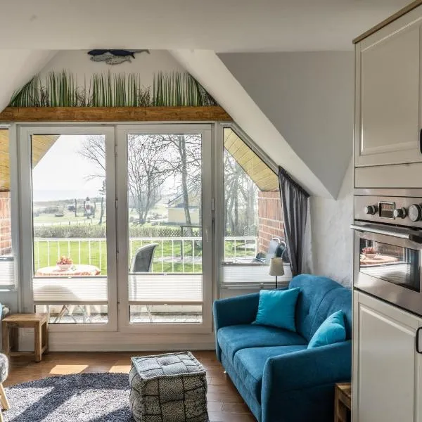 Urlaub mit Ostseeblick, Schwimmbad, Sauna & direkte Strandlage โรงแรมในKronsgaard