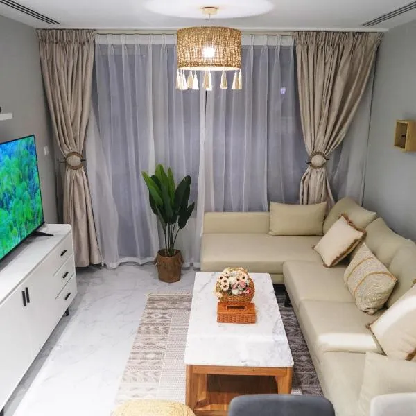 Elegant 2BR Jade Serenity - Chic Modern City Haven, hotel in Al Qurayyah