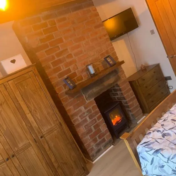 푸드시에 위치한 호텔 Quaint 1 bedroom cottage in Pudsey, Leeds