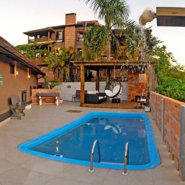 Bangalôs do Rosa-Praia do Rosa, отель в городе Имбитуба