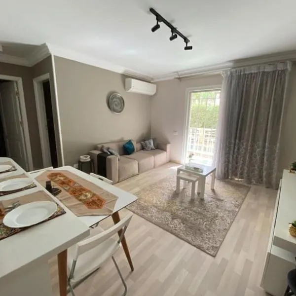 Ultra modern & super cozy apartment wz a private garden, hotel in Badr