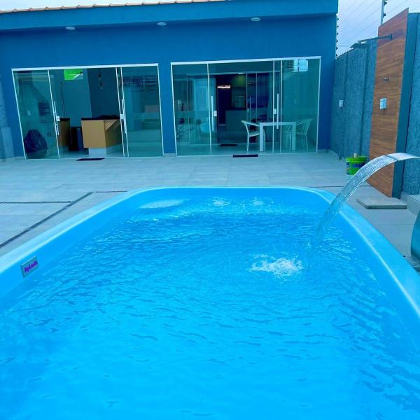 Casa com piscina e hidromassagem praia Enseada.