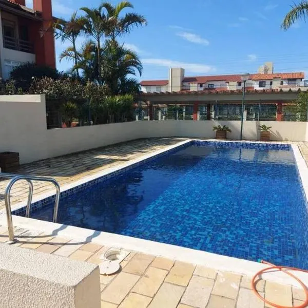 Apartamento em Capão Novo com piscina, hotel i Arroio Teixeira