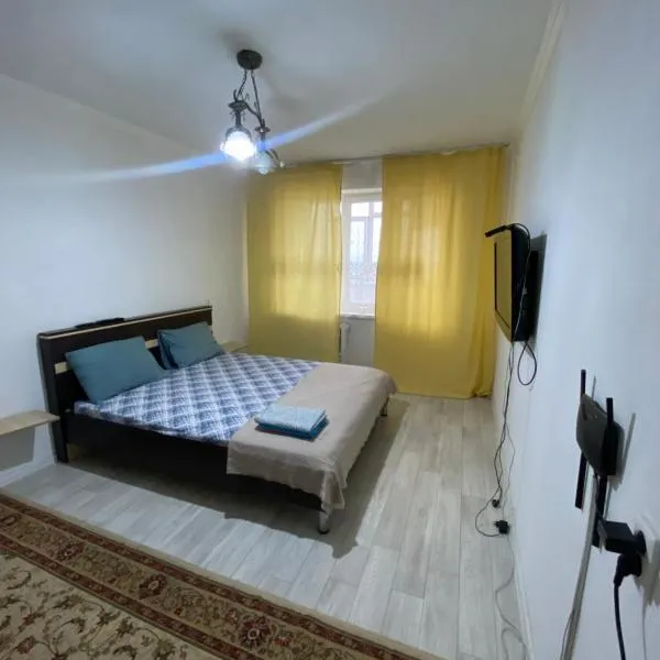 Уютные апартаменты в 11 микрорайоне (центр города), hotel in Akzhar