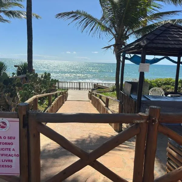 Flat Guarajuba 4 quartos térreo à Beira Mar - pé na areia - governança com arrumadeira e Wi Fi inclusos, hotell sihtkohas Camassari