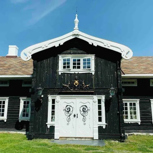 Eventyrlig Tømmerhytte på Gårdstun, hotel in Vinstra