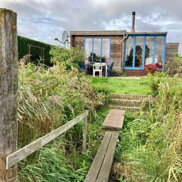 4pers - House w Sauna, Winter garden fishing pier in front of the Lauwersmeer, hotel in Anjum