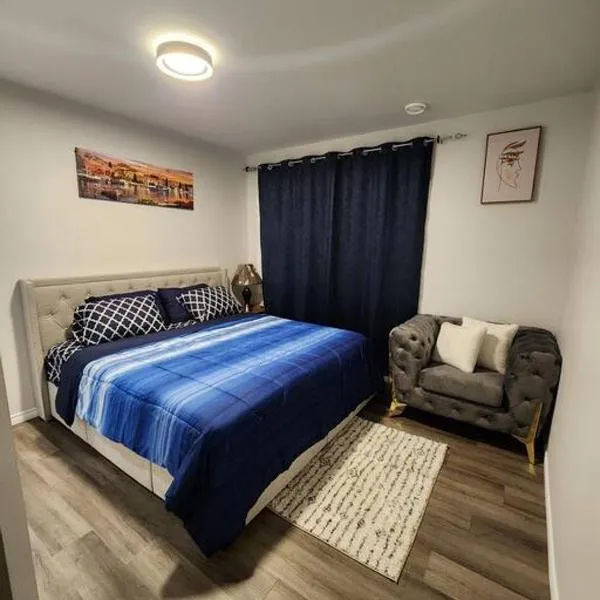 Cozy one bedroom in Airdrie、エイドリーのホテル